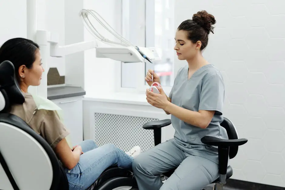 A dentist conducting a thorough Invisalign consultation, using digital imaging and models to explain the treatment process