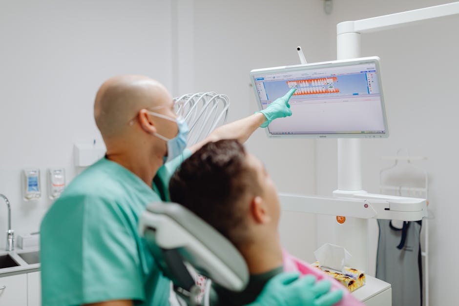 Dr. Michael Adams using advanced digital imaging technology for Invisalign treatment planning in a high-tech dental office