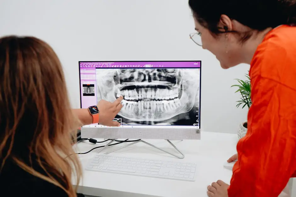 Orthodontist conducting an Invisalign consultation with a patient using advanced scanning technology