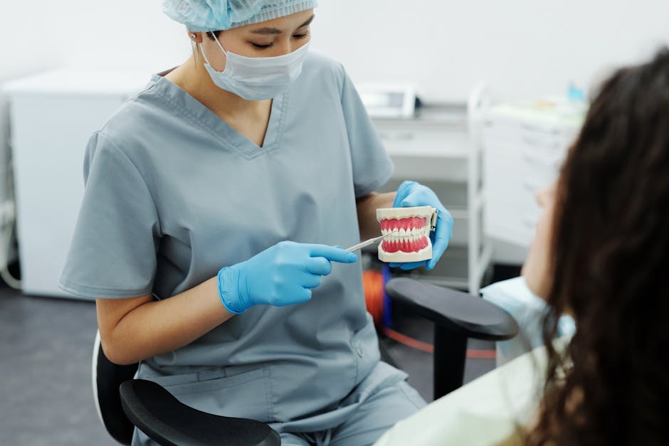 Orthodontist and patient discussing customized Invisalign treatment plan