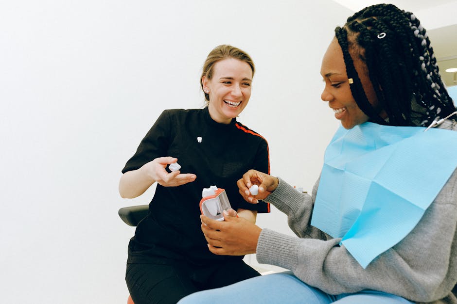 A dentist at SmileBeautiful DC discussing Invisalign treatment with a patient in a welcoming atmosphere